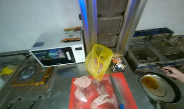 Cutting chicken on cutting board: egocentric robotics sample