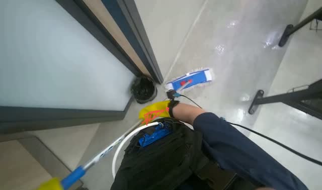 Mopping floor with flat mop: egocentric robotics sample