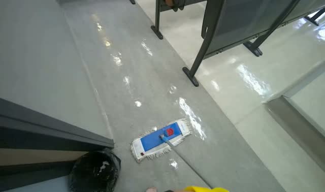 Mopping grey floor: egocentric robotics sample