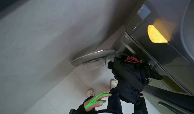 Loading clothes into dryer and starting cycle: egocentric robotics sample