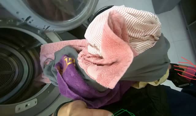Transferring clothes from machines to basket: egocentric robotics sample