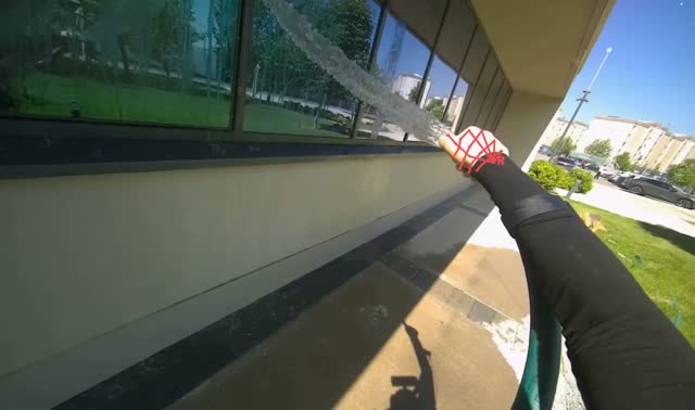 Spraying water on building windows: egocentric robotics sample