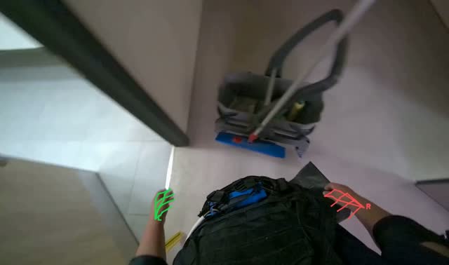 Setting up cleaning supplies in restroom: egocentric robotics sample