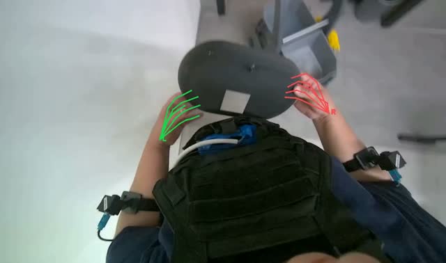 Handling black oval object: egocentric robotics sample