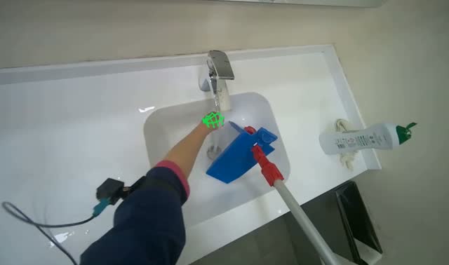 Washing and wringing mop head: egocentric robotics sample