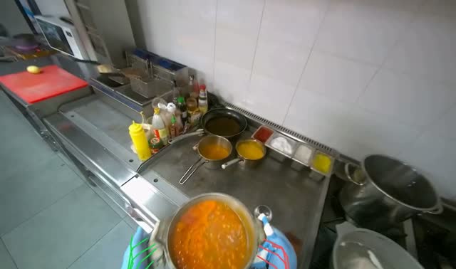 Removing meal from stove and placing another product: egocentric robotics sample