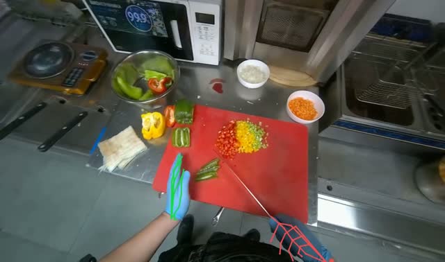 Chopping bell peppers on cutting board: egocentric robotics sample