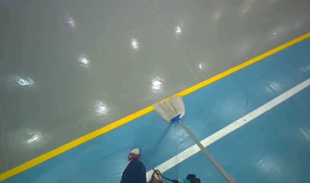 Mopping blue sports hall floor: egocentric robotics sample