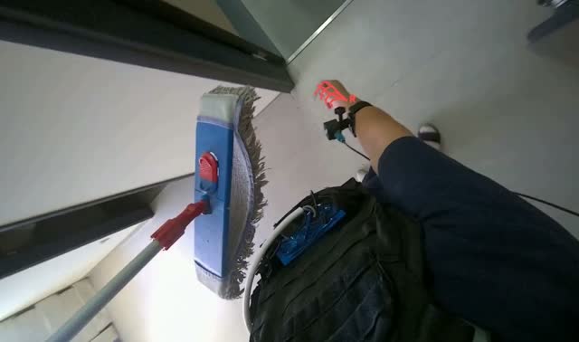 Rinsing and wringing mop head: egocentric robotics sample