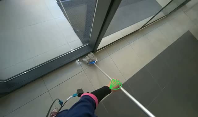 Mopping floor near glass door: egocentric robotics sample