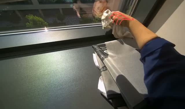 Wiping window ledge and frame: egocentric robotics sample