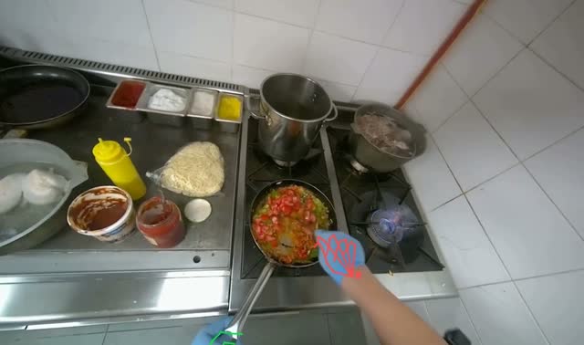 Adding and stirring vegetables in pan: egocentric robotics sample